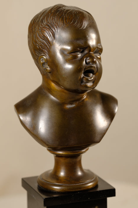 Bronze Statues of Laughing and Crying Infants