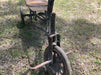 Vintage handcycle and antique item.