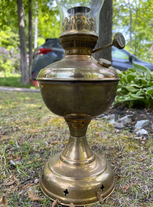Brass oil lamp #1018 and antique item.